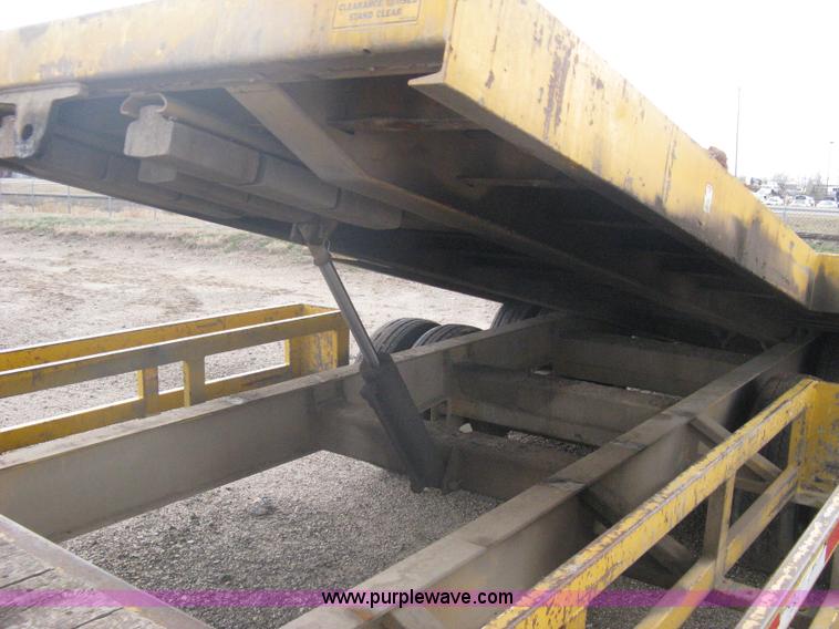 image for item A6102 2001 Trail King TKT20 tandem axle tilt bed trailer