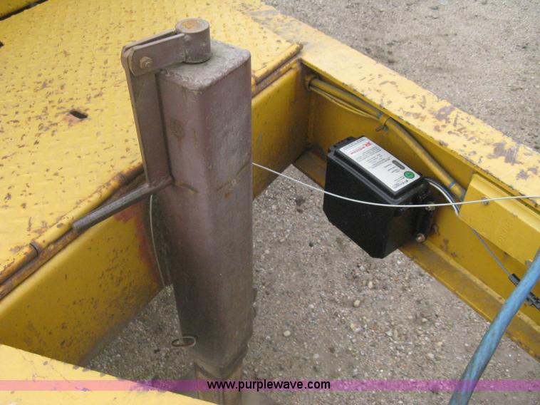 image for item A6102 2001 Trail King TKT20 tandem axle tilt bed trailer