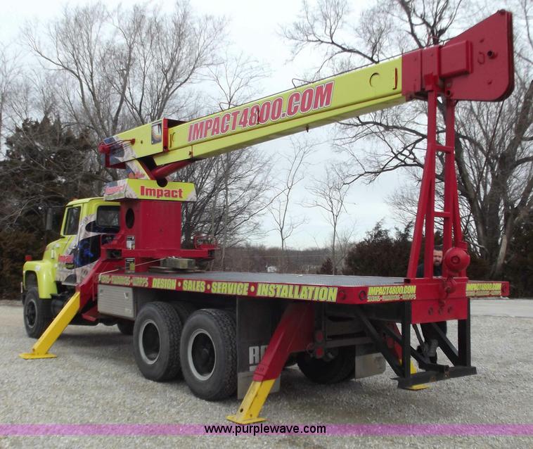 image for item D3504 1979 Ford flatbed truck with crane