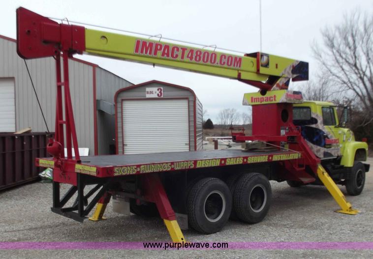image for item D3504 1979 Ford flatbed truck with crane