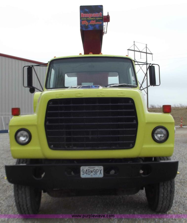 image for item D3504 1979 Ford flatbed truck with crane