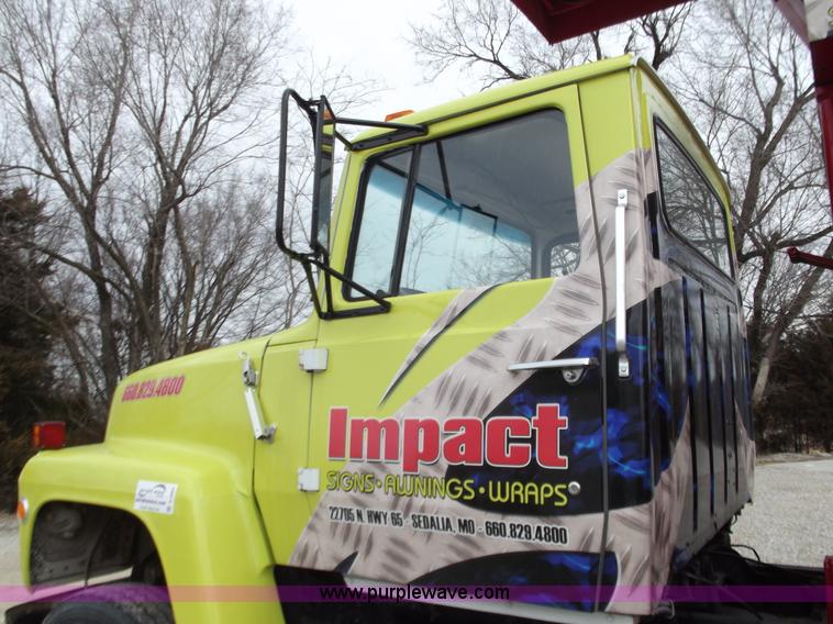 image for item D3504 1979 Ford flatbed truck with crane