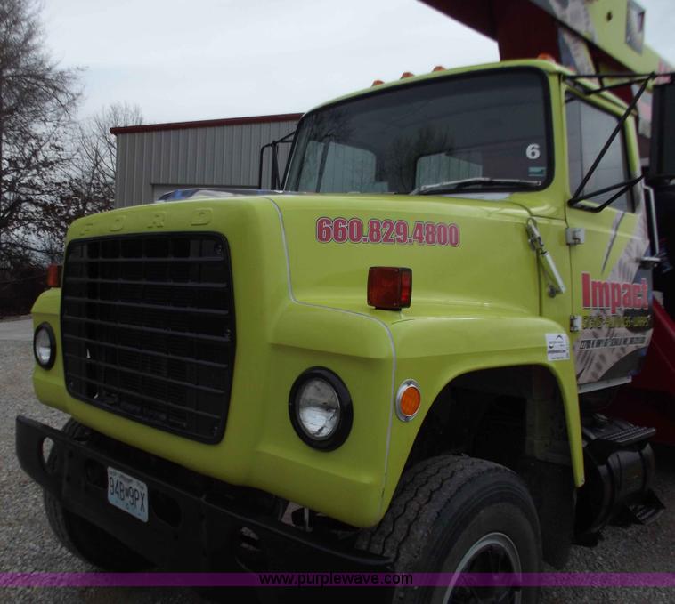 image for item D3504 1979 Ford flatbed truck with crane