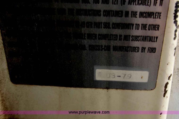 image for item D3504 1979 Ford flatbed truck with crane