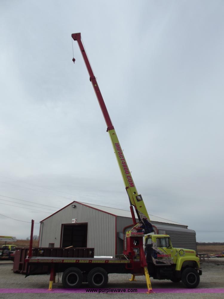 image for item D3504 1979 Ford flatbed truck with crane