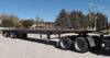 1992 58 3 flatbed trailer 8 1 W wood deck 6 5 side rails Stake pockets 10 axle spread Toolbox Spare ...