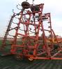 Hesston 45 field cultivator Spring reset shanks Three section Rear packer hitch Three bar coil tine ...