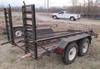 Thumbnail T_F4283E.JPG of 1977 13 tandem axle trailer , 75 quot W , 52 quot L x 18 quot W ramps , Pintle hitch , Safety break ...