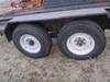 Thumbnail T_F4283H.JPG of 1977 13 tandem axle trailer , 75 quot W , 52 quot L x 18 quot W ramps , Pintle hitch , Safety break ...