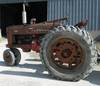 1955 Farmall 400 row crop tractor Four cylinder gas engine Manual transmission 5F 1R gears Spring su...