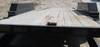 Thumbnail T_F3152M.JPG of 2010 Texas Bragg tilt deck trailer , 16L x 80 quot W wood deck , 4 tie downs , 41 quot x 17 quot too...
