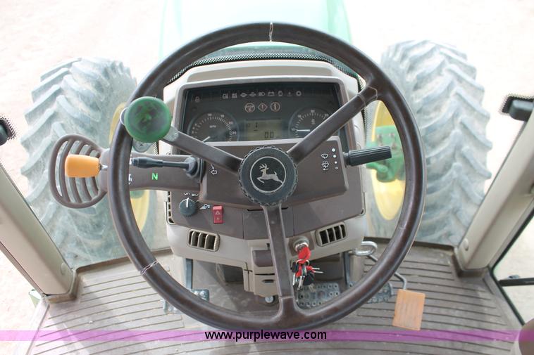 image for item E3256 2002 John Deere 6420 MFWD tractor