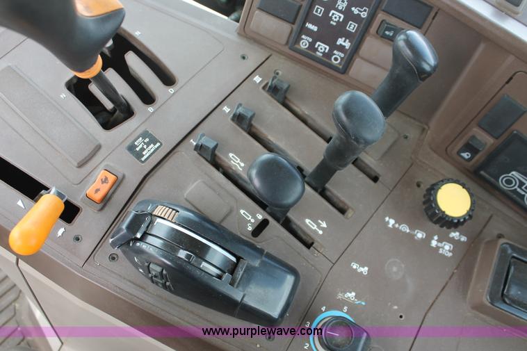 image for item E3256 2002 John Deere 6420 MFWD tractor