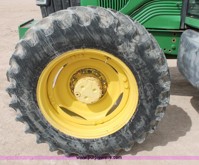 image for item E3256 2002 John Deere 6420 MFWD tractor