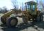 Graders and scrapers