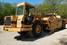 Graders and scrapers