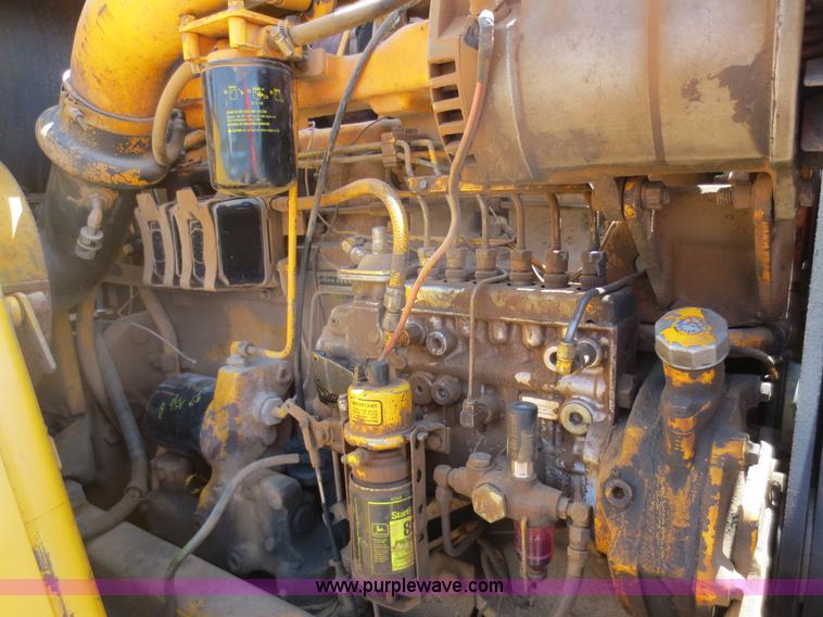 image for item D5995 1980 John Deere 762 paddle wheel scraper