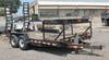 2006 PJ equipment trailer 16 L x 83 W 2 fold up ramps 89 L x 18 W Wood floor Steel sheet repairs on ...