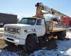 1988 Chevrolet 7000 flatbed truck with crane 60,116 miles on odometer 7 0L V8 gas engine Five speed ...