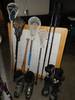 Assorted sporting goods Snow skis Ski boots Ski poles Baseball bat Lawn chairs Fishing net Fishing p...