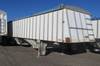 1985 Meritt 42 tandem axle grain trailer 8 W 10 H side boards Manual dual hopper Roll over tarp Spri...