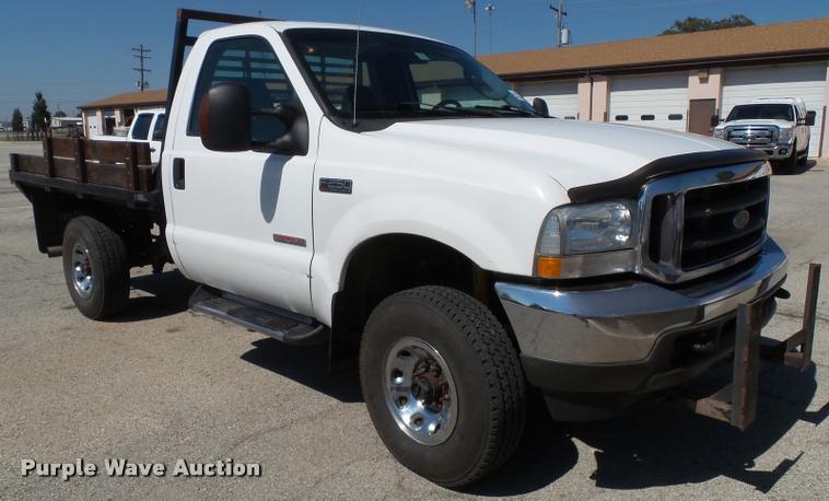 image for item J4792 2004 Ford F250 Super Duty XLT flatbed pickup truck