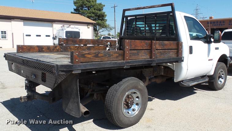 image for item J4792 2004 Ford F250 Super Duty XLT flatbed pickup truck