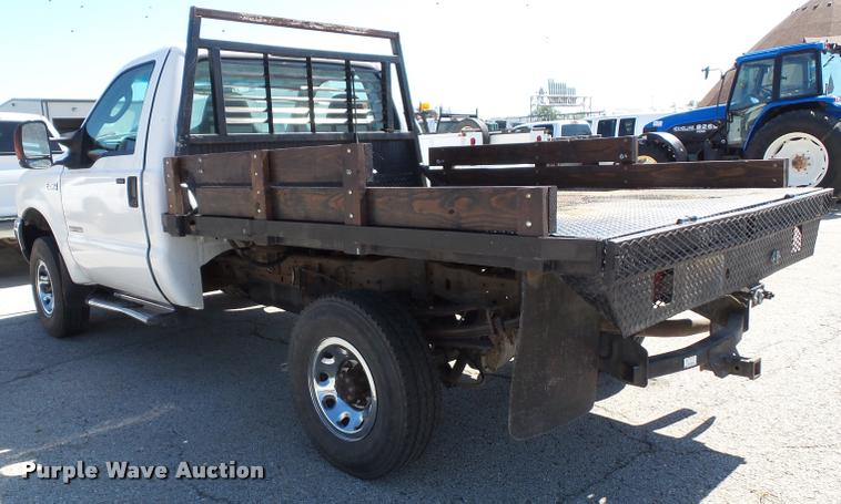 image for item J4792 2004 Ford F250 Super Duty XLT flatbed pickup truck