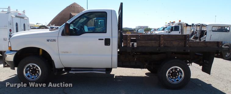 image for item J4792 2004 Ford F250 Super Duty XLT flatbed pickup truck