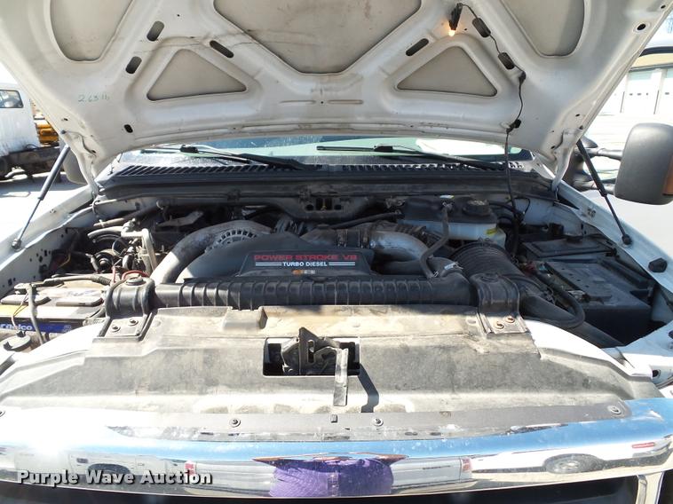 image for item J4792 2004 Ford F250 Super Duty XLT flatbed pickup truck