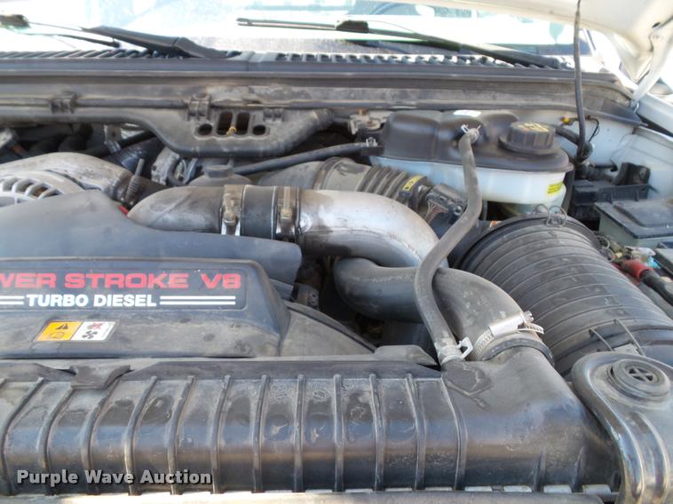 image for item J4792 2004 Ford F250 Super Duty XLT flatbed pickup truck