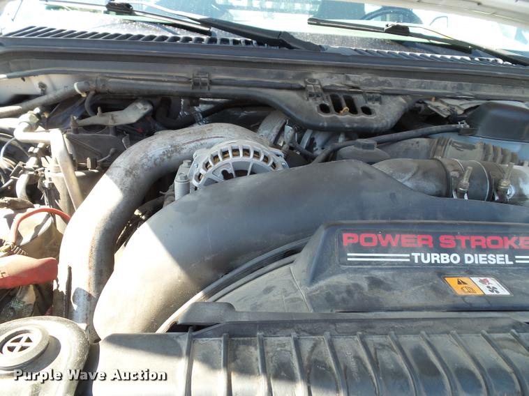 image for item J4792 2004 Ford F250 Super Duty XLT flatbed pickup truck