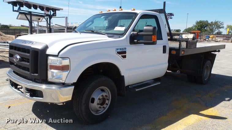 image for item J4801 2009 Ford F350 Super Duty XL flatbed pickup truck