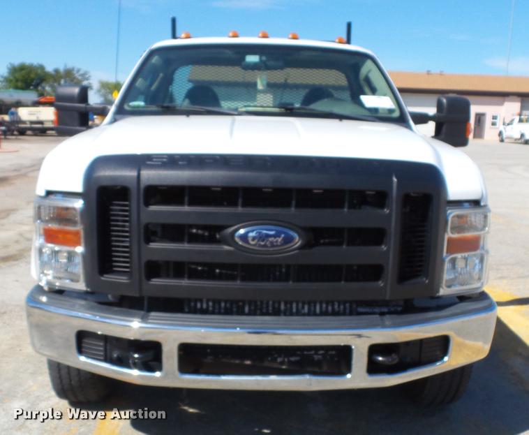 image for item J4801 2009 Ford F350 Super Duty XL flatbed pickup truck