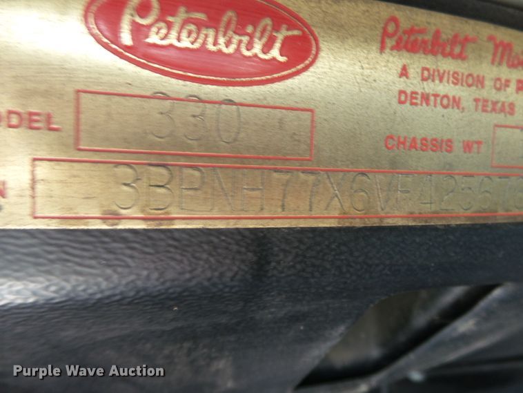 image for item DE7995 1997 Peterbilt 330 flatbed truck