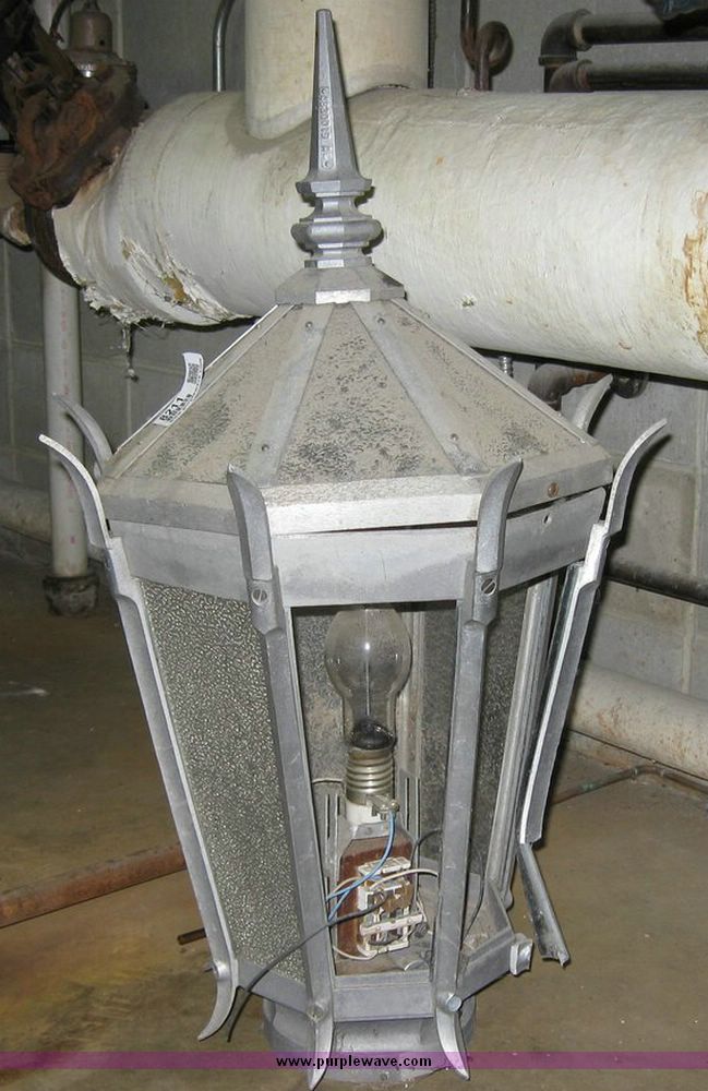 image for item 8211 General Electric metal and glass lamp