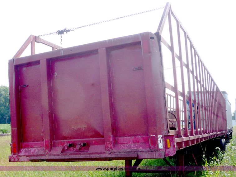 image for item 5009 1980 Fruehauf tandem axle flatbed trailer with edge