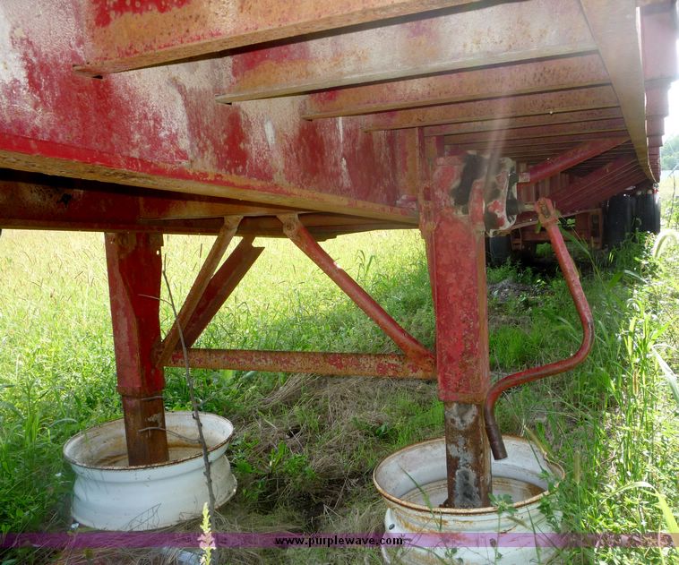 image for item 5009 1980 Fruehauf tandem axle flatbed trailer with edge