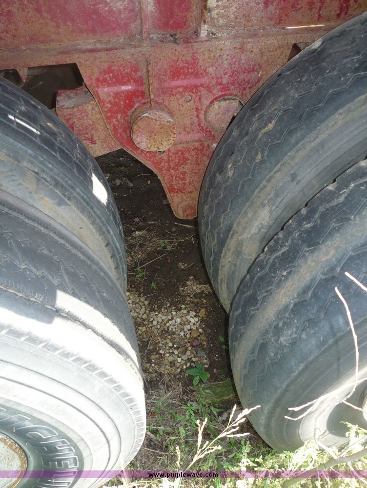 image for item 5009 1980 Fruehauf tandem axle flatbed trailer with edge