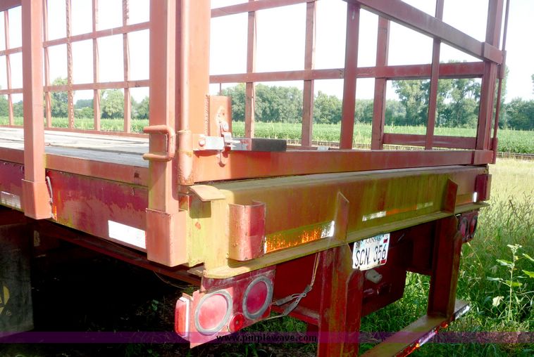 image for item 5009 1980 Fruehauf tandem axle flatbed trailer with edge