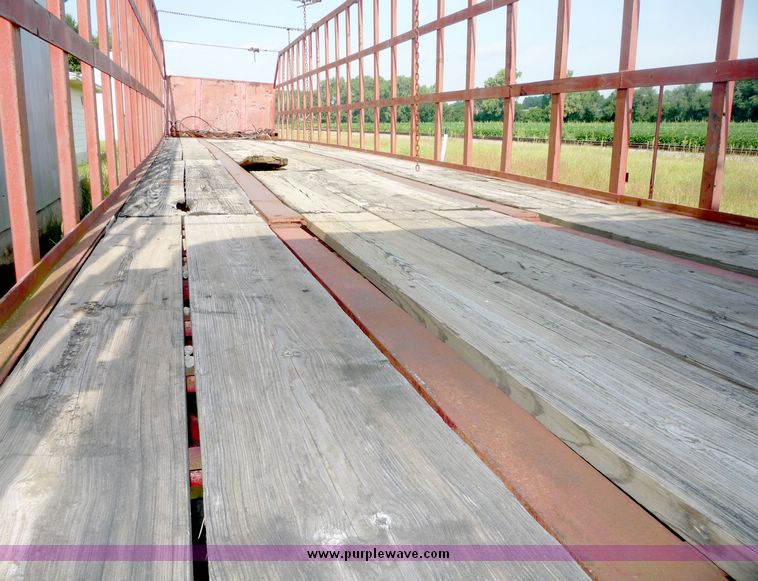 image for item 5009 1980 Fruehauf tandem axle flatbed trailer with edge