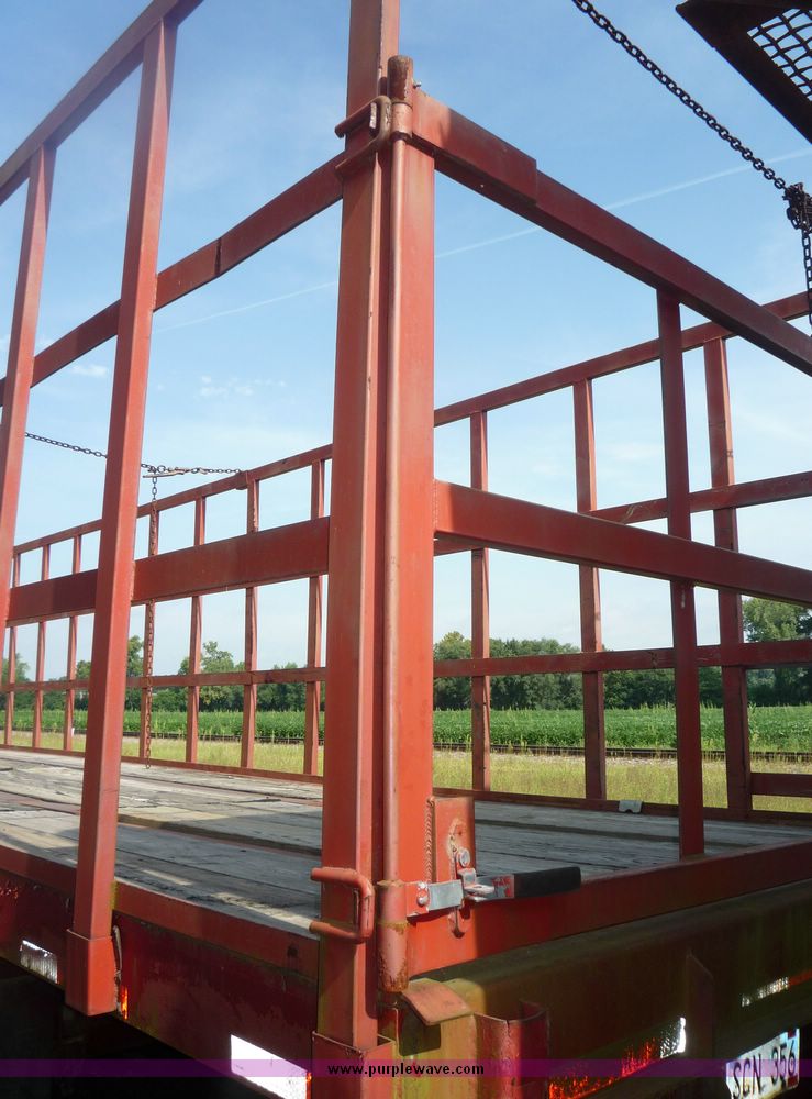 image for item 5009 1980 Fruehauf tandem axle flatbed trailer with edge