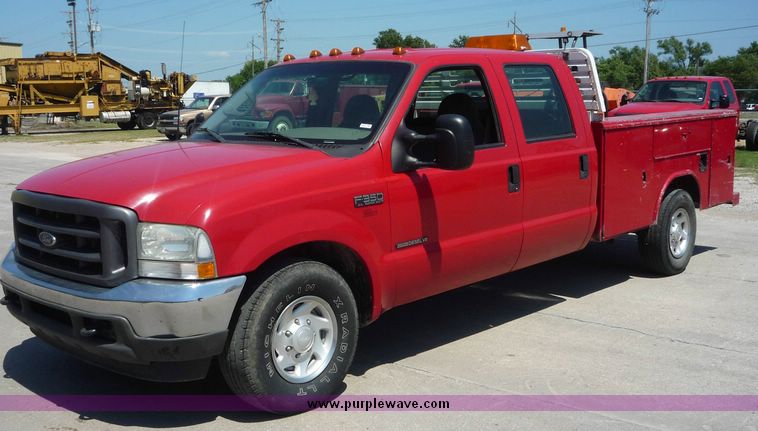 image for item 4043 2002 Ford F350 Super Duty crew cab pickup with Reading utility bed