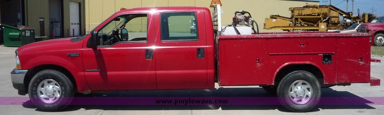 image for item 4043 2002 Ford F350 Super Duty crew cab pickup with Reading utility bed