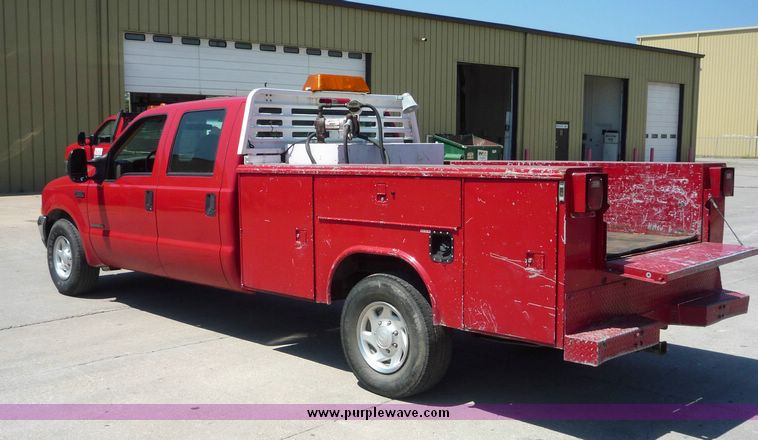 image for item 4043 2002 Ford F350 Super Duty crew cab pickup with Reading utility bed