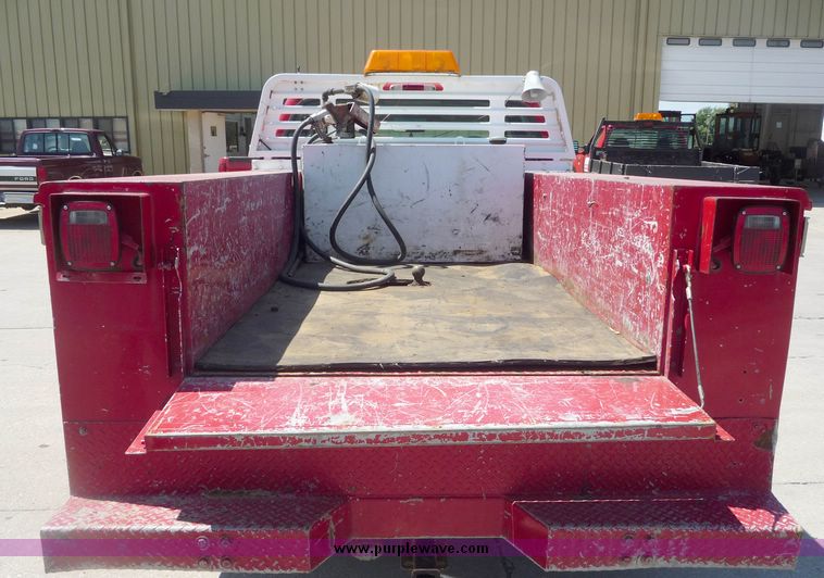 image for item 4043 2002 Ford F350 Super Duty crew cab pickup with Reading utility bed