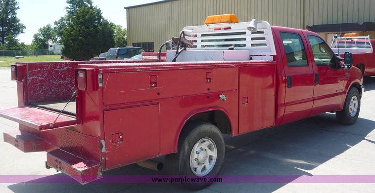 image for item 4043 2002 Ford F350 Super Duty crew cab pickup with Reading utility bed