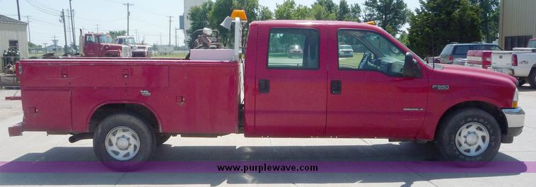 image for item 4043 2002 Ford F350 Super Duty crew cab pickup with Reading utility bed