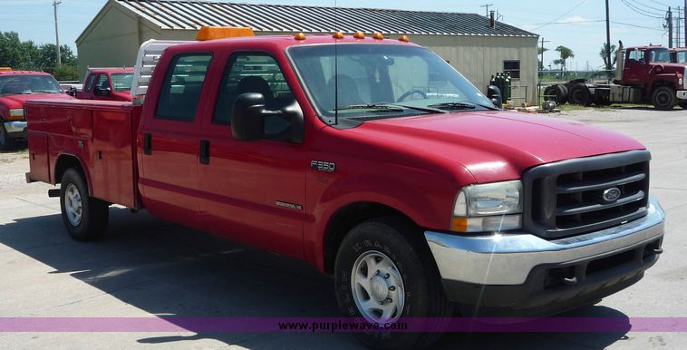 image for item 4043 2002 Ford F350 Super Duty crew cab pickup with Reading utility bed