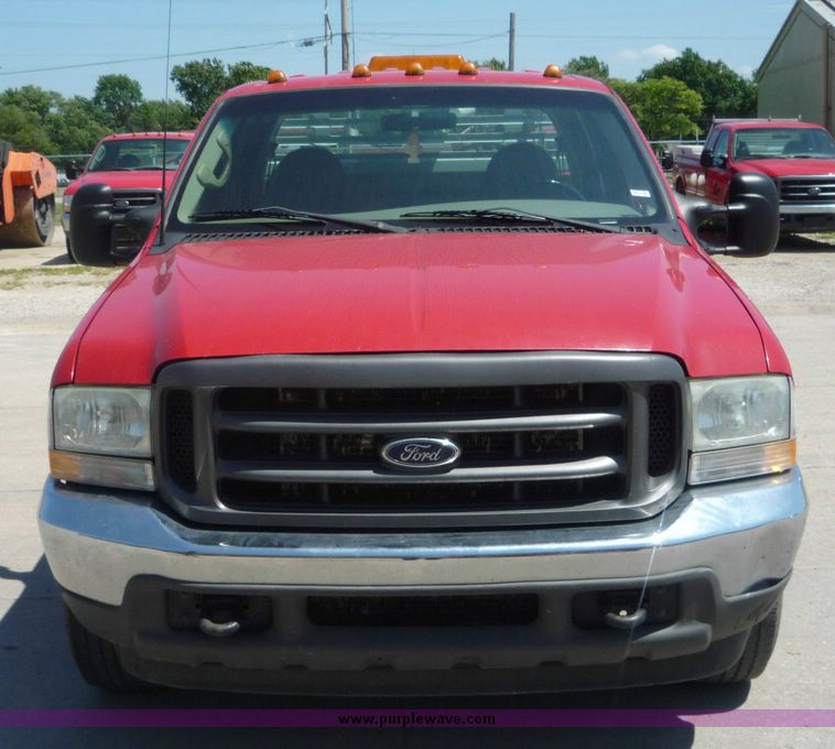 image for item 4043 2002 Ford F350 Super Duty crew cab pickup with Reading utility bed